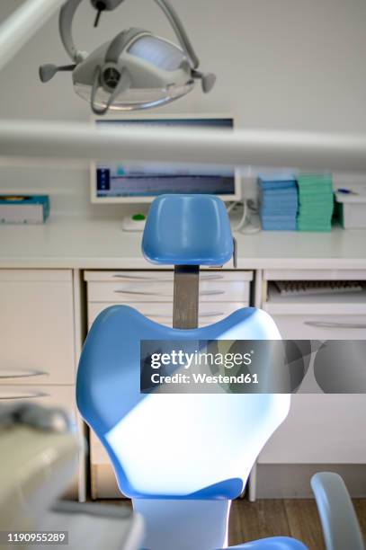 dental clinic blue seat only - dentists chair stock pictures, royalty-free photos & images