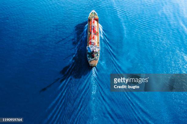tanker truck moving on the sea. - vista marina fotografías e imágenes de stock