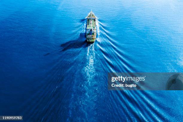 tanker truck moving on the sea. - oil container stock pictures, royalty-free photos & images