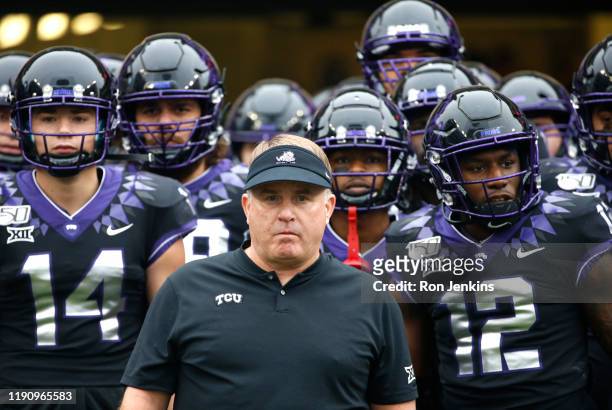 Head coach Gary Patterson of the TCU Horned Frogs waits with players before being introduced before the game with the West Virginia Mountaineers at...