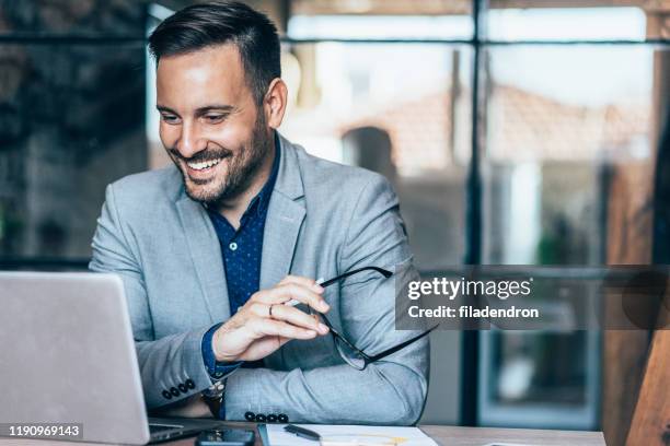 young businessman working at office - business man on computer imagens e fotografias de stock
