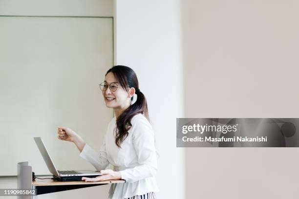 business woman giving a presentation. - セミナー　日本人 ストックフォトと画像