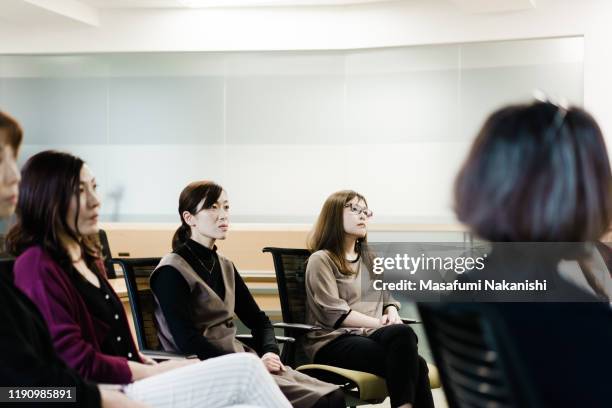 business woman listening to seminar - japan training session stock pictures, royalty-free photos & images