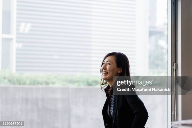 portrait of smiling female business woman - portrait business japanese stock pictures, royalty-free photos & images