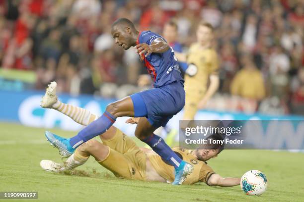 Abdiel Arroyo of the Newcastle Jets contests the ball with Dylan McGowan of the Western Sydney Wanderers during the round eight A-League match...