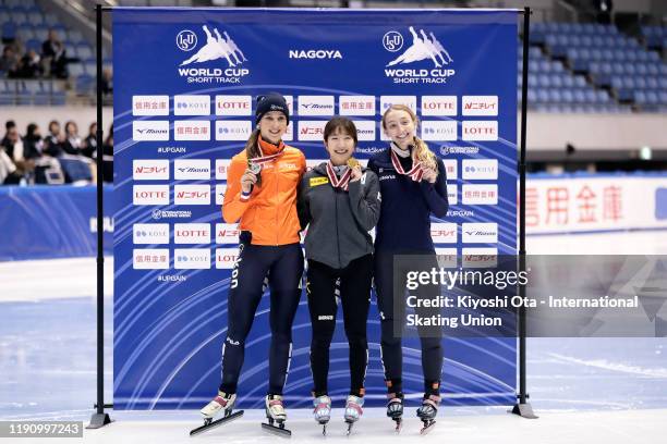 Gold medalist Noh Ah Rum of South Korea celebrates with silver medalist Suzanne Schulting of the Netherlands and bronze medalist Kristen Santos of...