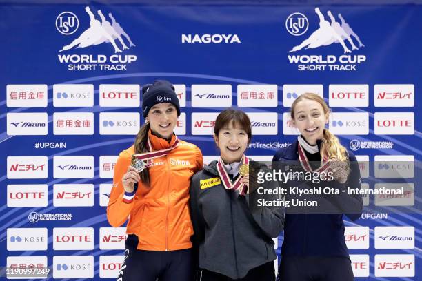 Gold medalist Noh Ah Rum of South Korea celebrates with silver medalist Suzanne Schulting of the Netherlands and bronze medalist Kristen Santos of...