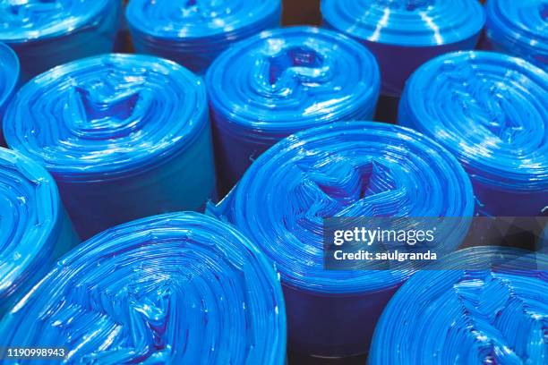 close-up of plastic coils of garbage bags - garbage bag stock pictures, royalty-free photos & images