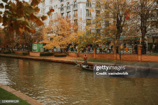 people doing gondola ride in autumn in eskisehir turkey - eskisehir stock pictures, royalty-free photos & images