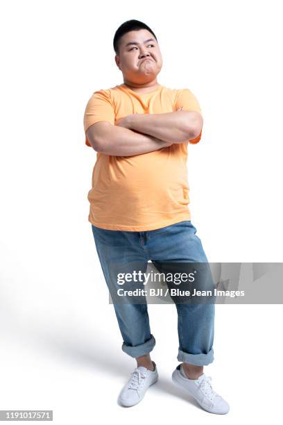 young chinese man sulking - fat asian man stockfoto's en -beelden