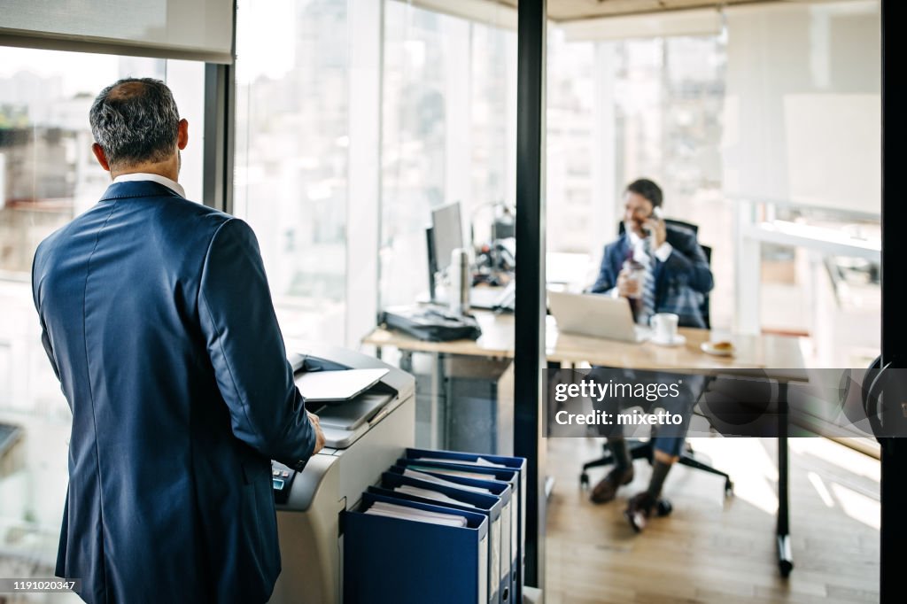 Two businessmen working at office