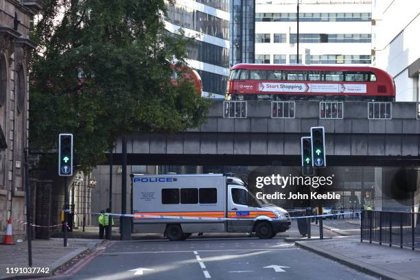 Police tape off Lower Thames Street following yesterday's London Bridge stabbing attack as investigations continue on November 30, 2019 in London,...