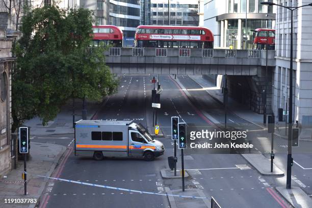 Police tape off Lower Thames Street following yesterday's London Bridge stabbing attack as investigations continue on November 30, 2019 in London,...