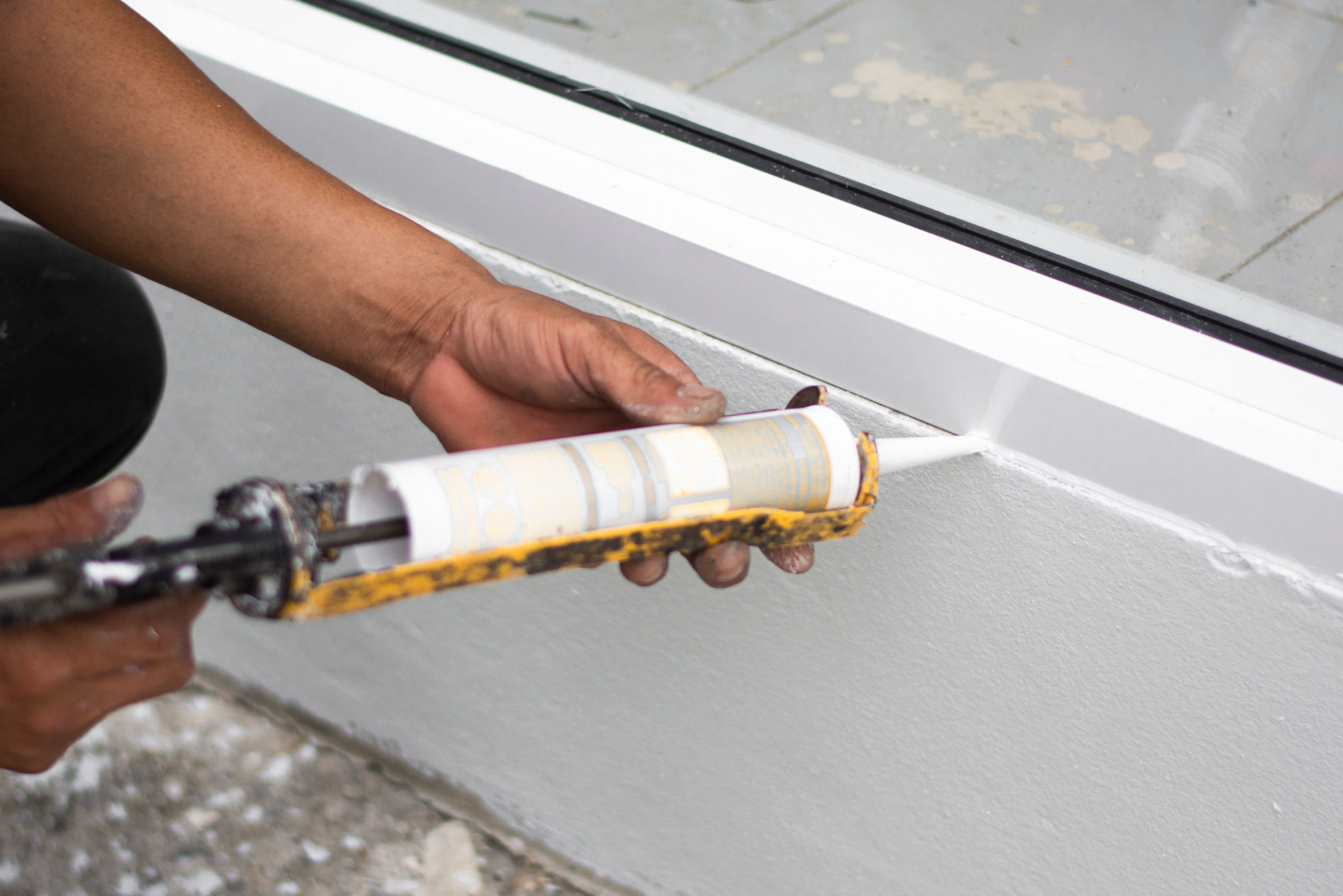 applying caulk