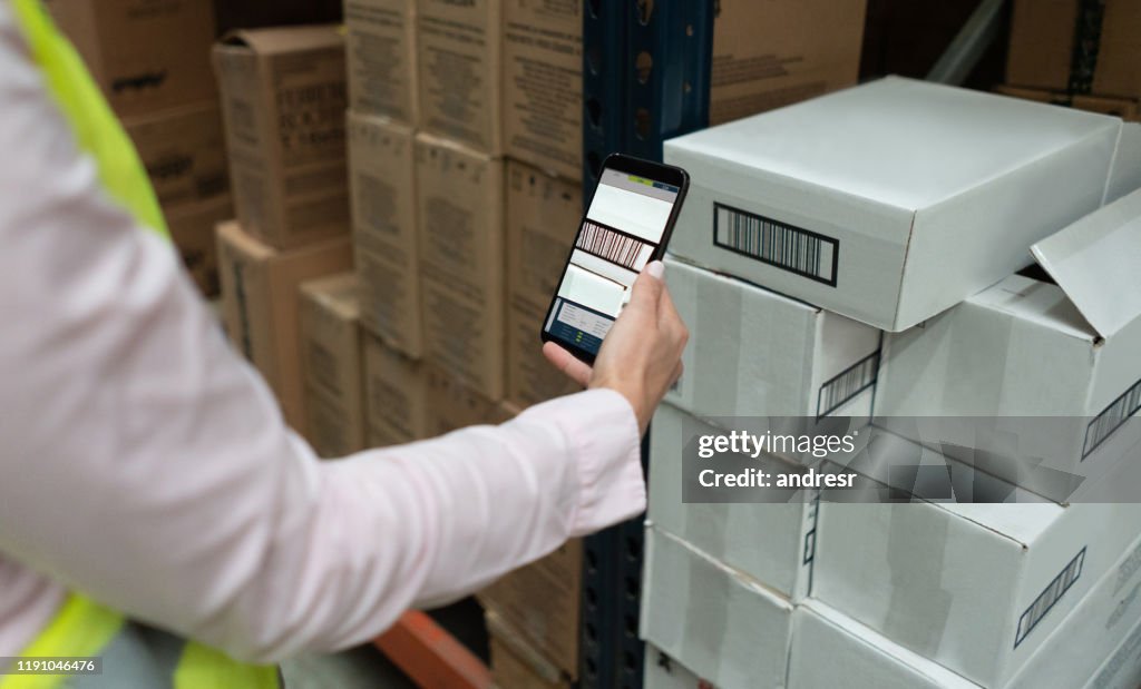 Worker scanning products at a distribution warehouse