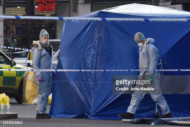 Forensic officers investigate the scene of yesterday's London Bridge stabbing attack on November 30, 2019 in London, England. A man and a woman were...