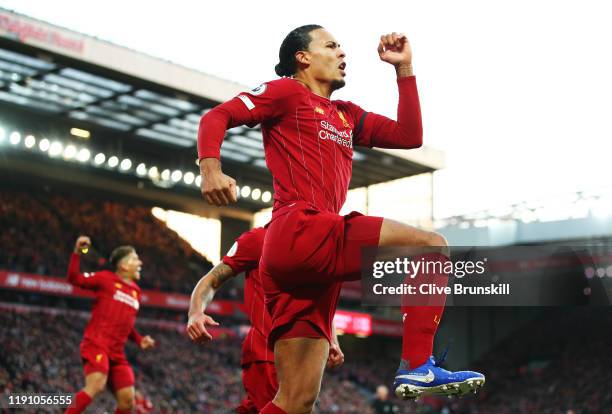 Virgil van Dijk of Liverpool celebrates after scoring his teams first goal during the Premier League match between Liverpool FC and Brighton & Hove...