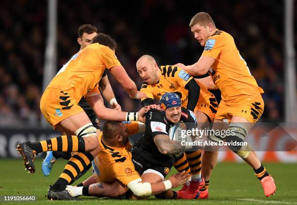 Jack Nowell of Exeter Chiefs is is tackled by Will Rowlands, Jack Willis, Zurabi Zhvania and Dan Robson of Wasps during the Gallagher Premiership...