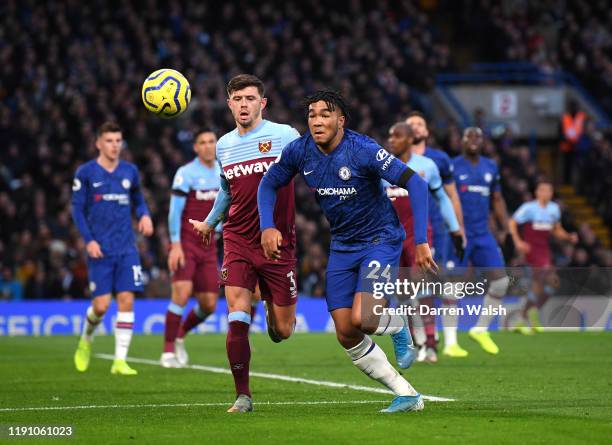 Reece James of Chelsea is put under pressure by Aaron Cresswell of West Ham United during the Premier League match between Chelsea FC and West Ham...