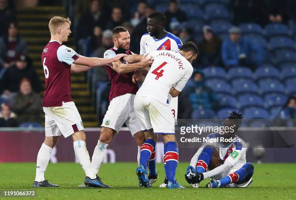 Phil Bardsley of Burnley clashes with Luka Milivojevic of Crystal Palace during the Premier League match between Burnley FC and Crystal Palace at...