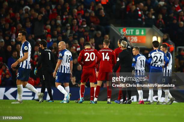 Alisson of Liverpool is sent off by referee Martin Atkinson during the Premier League match between Liverpool FC and Brighton & Hove Albion at...
