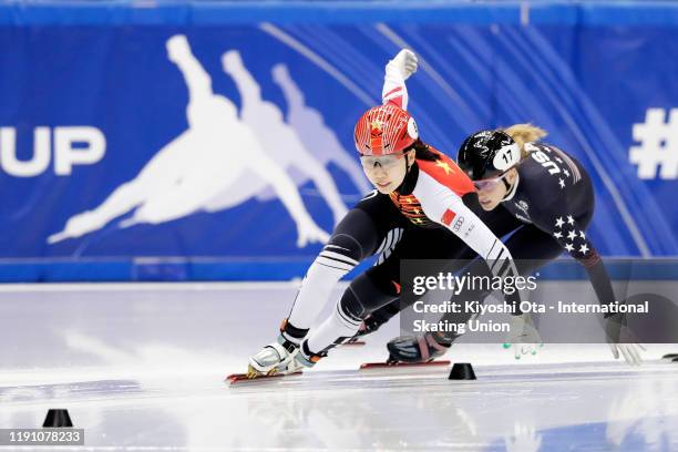 Zang Yize of China competes against Kristen Santos of the United States in the Ladies' 1000m Quarterfinal during the ISU World Cup Short Track at the...