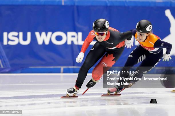 Courtney Lee Sarault of Canada competes against Rianne De Vries of the Netherlands in the Ladies' 1000m Quarterfinal during the ISU World Cup Short...