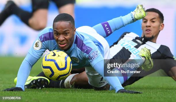 City player Raheem Sterling is challenged by Isaac Hayden during the Premier League match between Newcastle United and Manchester City at St. James...