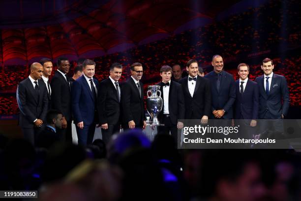 Euro 2020 Draw guests pose for a photo with the The Henri Delaunay Trophy following the UEFA Euro 2020 Final Draw Ceremony at the Romexpo on November...