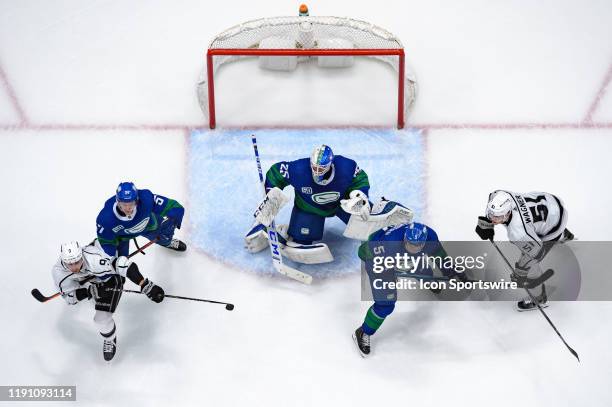 Vancouver Canucks Goaltender Jacob Markstrom Defenseman Tyler Myers Defenseman Oscar Fantenberg defend against Los Angeles Kings Left Wing Adrian...