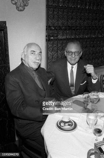 Alfred Knopf founder of publishing company Alfred A. Knopf, Inc., at lunch with Random House publisher Bennett Cerf , celebrating the merger of their...