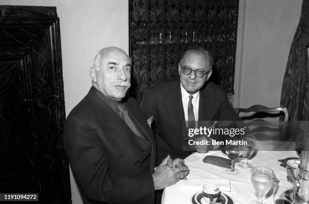 Alfred Knopf founder of publishing company Alfred A. Knopf, Inc., at lunch with Random House publisher Bennett Cerf , celebrating the merger of their...