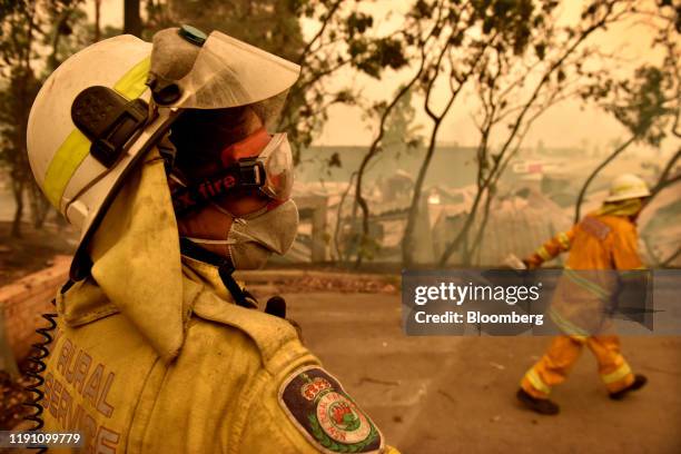 Members of the New South Wales Rural Fire Service are seen in Batemans Bay, New South Wales, Australia, on Tuesday, Dec. 31, 2019. Australia's...