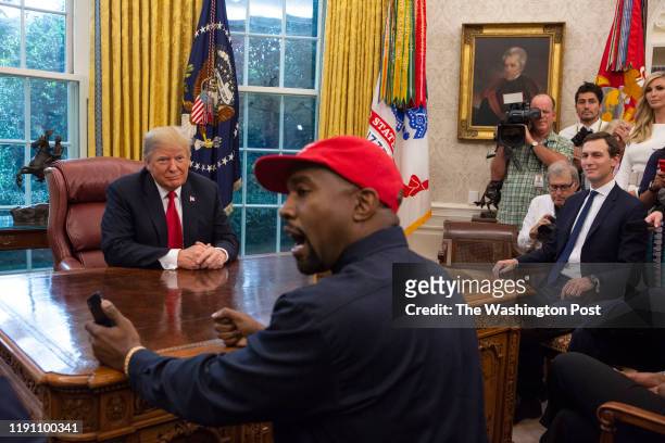 President Donald Trump meets with rapper Kanye West in the Oval Office of the White House in Washington D.C. On October 11, 2018.