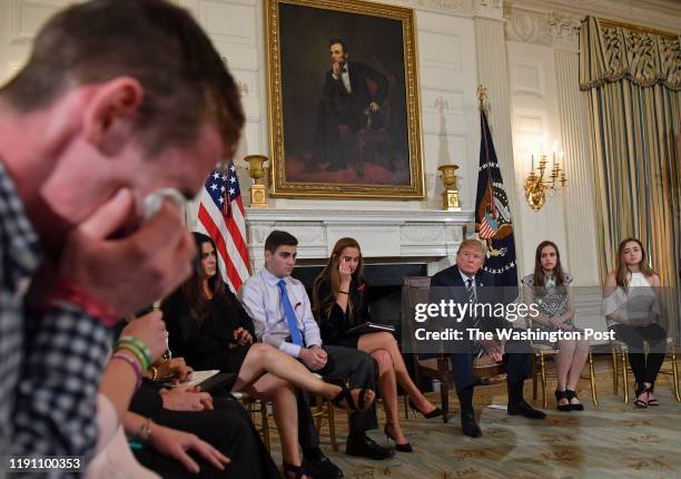Samuel Zeif, student at Marjory Stoneman Douglas High School, left, weeps after recounting his story of the shooting incident at his high school as...