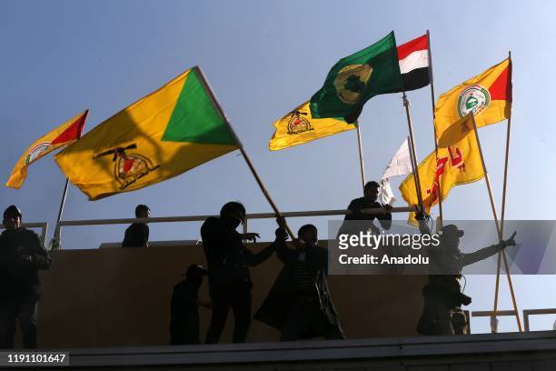 Outraged Iraqi protesters storm the U.S. Embassy in Baghdad, protesting Washington's attacks on armed battalions belong to Iranian-backed Hashd...