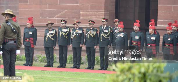 Outgoing Chief of Army Staff General Bipin Rawat poses for a photograph with other officers after inspecting the Guard of Honour, at South Block...