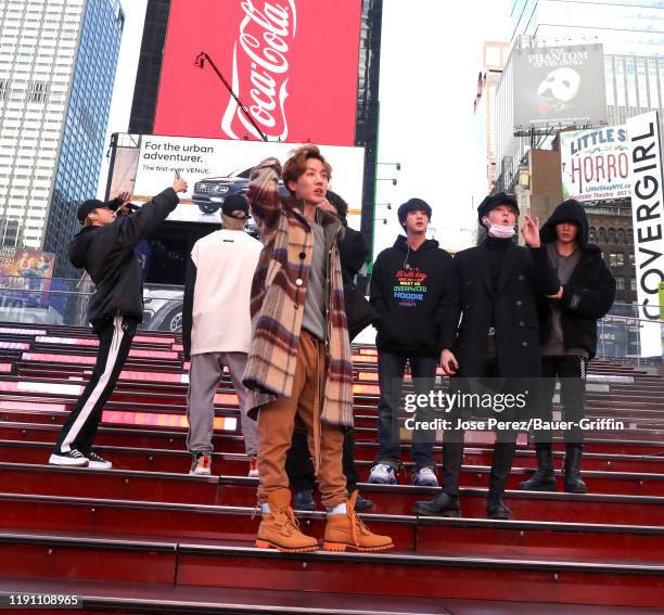 Pop band, BTS is seen in Times Square on December 31, 2019 in New York City.