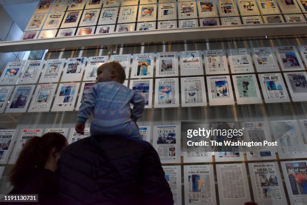Museum goers check out the 9/11 exhibit at the Newseum on the last day it will be in operation on Tuesday, December 31 in Washington, DC. The museum...
