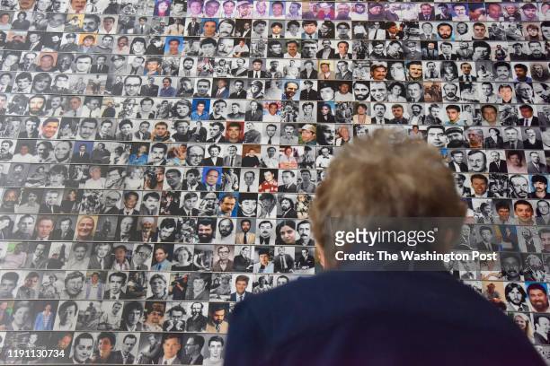Museum goers check out the fallen journalist exhibit at the Newseum on the last day it will be in operation on Tuesday, December 31 in Washington,...