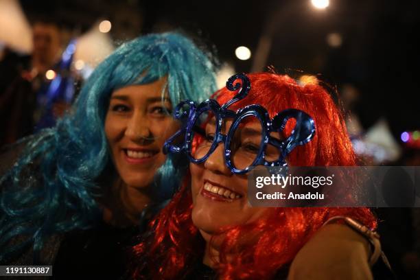 People are seen in the Angel de la Independencia in the New Year's eve celebaration in Mexico City, Mexico on December 31, 2019.