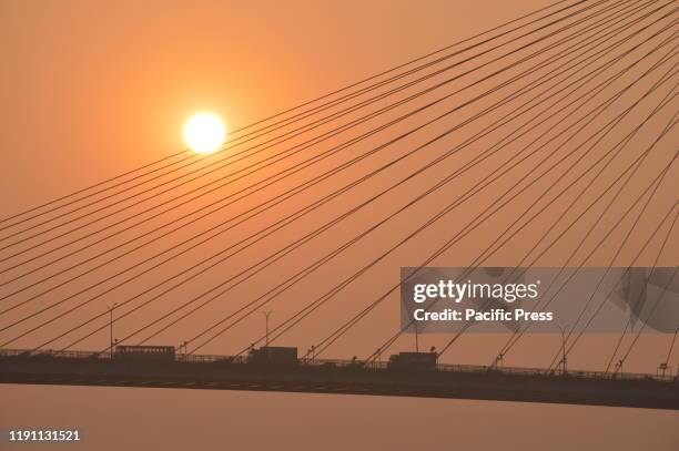 The setting sun over the Ganges through the Vidyasagar Setu on the last day of calendar year 2019.