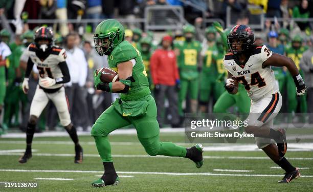 Running back Cyrus Habibi-Likio of the Oregon Ducks runs for a touchdown during the second half of the game against the Oregon State Beavers at...