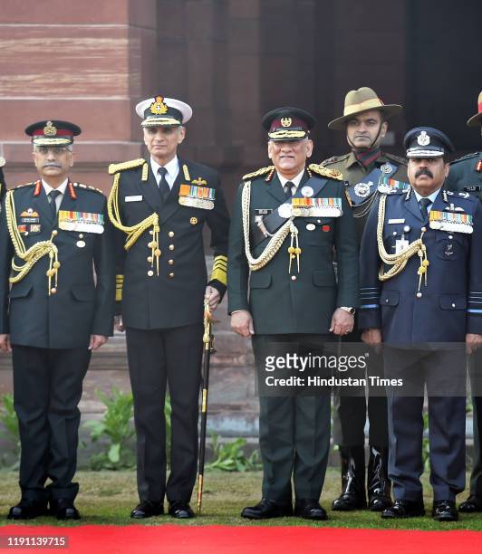 India's first Chief of Defence Staff Gen Bipin Rawat poses for a group photograph with Army Chief General Manoj Mukund Naravane , Navy Chief Admiral...