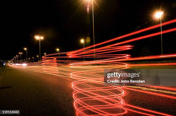 high speed light trails and buildings - broadband speed ストックフォトと画像