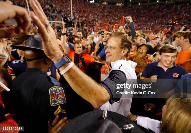 Head coach Gus Malzahn of the Auburn Tigers celebrates their 48-45 win over the Alabama Crimson Tide at Jordan Hare Stadium on November 30, 2019 in...