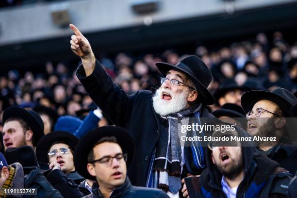 Orthodox Jews attend during the 13th Siyum HaShas, a celebration marking the completion of the Daf Yomi, at the MetLife Stadium on January 1, 2020 in...