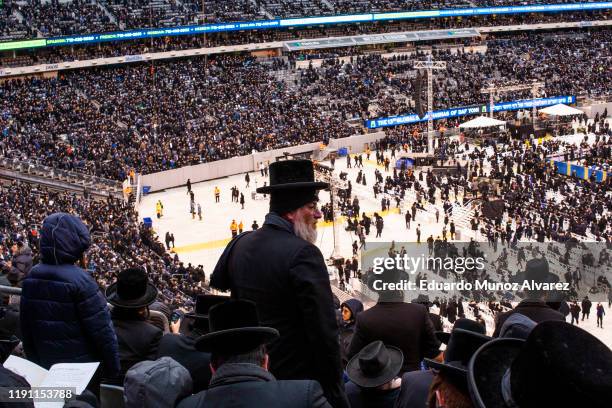 Orthodox Jews attend the 13th Siyum HaShas, a celebration marking the completion of the Daf Yomi, at the MetLife Stadium on January 1, 2020 in East...