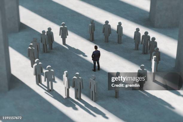 man standing in a group of people - government relations stock pictures, royalty-free photos & images