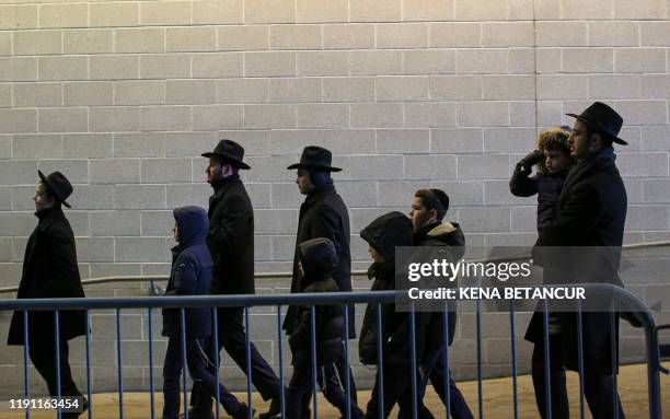 People congregate at the MetLife Stadium to celebrate Siyum HaShas, the completion of the reading of the Babylonian Talmud, on January 1 in East...